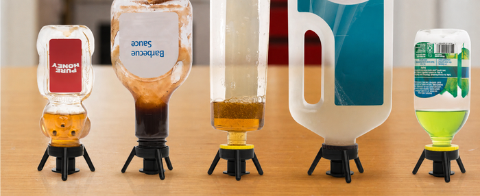 The 3 caps (small / medium / large) lined up next to the bottles each one fits